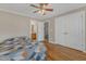 Bedroom featuring a ceiling fan, closet and a view of the en suite bathroom at 5521 Erinvale Ct, Holly Springs, NC 27540