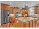 Spacious kitchen with stainless steel appliances and granite island at 5521 Erinvale Ct, Holly Springs, NC 27540