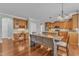 Kitchen eat-in area with wooden floors and table with view into another kitchen area at 5521 Erinvale Ct, Holly Springs, NC 27540