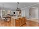 Kitchen island with great view of the fireplace and staircase at 5521 Erinvale Ct, Holly Springs, NC 27540