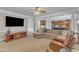 Inviting living room offering seamless transition to the adjacent kitchen at 5521 Erinvale Ct, Holly Springs, NC 27540