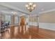 Elegant living area with hardwood floors, decorative wainscoting, and classic architectural details at 5521 Erinvale Ct, Holly Springs, NC 27540