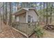 Charming shed with a deck offering a private retreat in the backyard at 5521 Erinvale Ct, Holly Springs, NC 27540