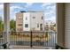 View from balcony of modern townhome community, featuring contemporary design and landscaping at 607 N Queen St, Durham, NC 27701