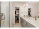 Modern bathroom with double vanity, quartz countertop, and a glass enclosed shower at 607 N Queen St, Durham, NC 27701