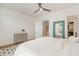 Bright, airy bedroom with stylish dresser, plush bedding, and neutral colors at 607 N Queen St, Durham, NC 27701