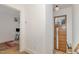 Bright entryway with hardwood floors, leading to an office space and features a stylish wood door at 607 N Queen St, Durham, NC 27701