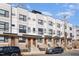 Modern townhome exteriors featuring brick and siding, complemented by sleek black framed windows at 607 N Queen St, Durham, NC 27701