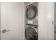 Modern stacked washer and dryer inside a laundry closet for space-saving convenience at 607 N Queen St, Durham, NC 27701
