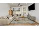 Contemporary living room featuring neutral tones, hardwood floors, and ample natural light at 607 N Queen St, Durham, NC 27701