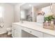 Bright bathroom featuring a sleek vanity with white countertop and ample storage space at 733 Frosty Way, Zebulon, NC 27597