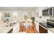 Eat-in kitchen with stainless steel appliances, granite countertops, and backyard access at 733 Frosty Way, Zebulon, NC 27597