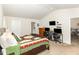 The primary bedroom features recessed lighting, neutral decor, and plush carpeting at 733 Frosty Way, Zebulon, NC 27597