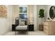 Cozy bedroom features a dark metal bed frame, decorative lighting, and unique wall art at 804 Basswood Glen Trl, Knightdale, NC 27545