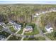 Beautiful aerial view of the luxury home with manicured lawn and mature trees in an upscale neighborhood at 8117 Fergus Ct, Wake Forest, NC 27587