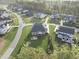 Aerial view of a home with a backyard featuring a patio and a fire pit at 8117 Fergus Ct, Wake Forest, NC 27587