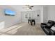 Carpeted bonus room with large television, foosball table, and comfortable leather chairs at 8117 Fergus Ct, Wake Forest, NC 27587