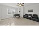Carpeted bonus room with large television, foosball table, and comfortable leather chairs at 8117 Fergus Ct, Wake Forest, NC 27587