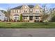 Beautiful brick home featuring a manicured lawn and charming front porch at 8117 Fergus Ct, Wake Forest, NC 27587