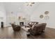 Bright living room features vaulted ceilings, a fireplace, and comfortable leather seating arrangement at 8117 Fergus Ct, Wake Forest, NC 27587