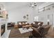 Bright living room features high ceilings, a cozy fireplace, and comfortable leather seating arrangement at 8117 Fergus Ct, Wake Forest, NC 27587
