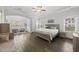 Bright and airy main bedroom features a trey ceiling, neutral decor, and hardwood floors at 8117 Fergus Ct, Wake Forest, NC 27587