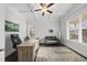 Bright office space with a coffered ceiling, large windows, and built-in desk at 8117 Fergus Ct, Wake Forest, NC 27587
