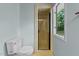 Bright bathroom with a glass shower, and window at 8805 Leesville Rd, Raleigh, NC 27613