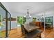Dining room with hardwood floors, chandelier and views to an outdoor deck at 8805 Leesville Rd, Raleigh, NC 27613