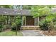 Close-up view of the stone entrance with stone steps to the double front door at 8805 Leesville Rd, Raleigh, NC 27613