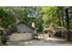 Attached two-car garage and covered parking area, surrounded by trees at 8805 Leesville Rd, Raleigh, NC 27613