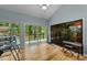 Light-filled room with floor-to-ceiling windows offering backyard views at 8805 Leesville Rd, Raleigh, NC 27613