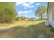 Large backyard with garage, extra storage and new white house at 8917 Fowler Rd, Zebulon, NC 27597