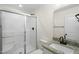 Modern bathroom with sleek granite countertop and walk-in shower at 8917 Fowler Rd, Zebulon, NC 27597