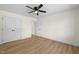 A bright bedroom featuring neutral walls, laminate floors and a ceiling fan at 8917 Fowler Rd, Zebulon, NC 27597