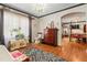 Large primary bathroom with hardwood floors, a chandelier, and bright natural light at 906 Perry Rd, Zebulon, NC 27597