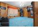 Bedroom features wood paneling, blue carpet and a vintage vibe at 906 Perry Rd, Zebulon, NC 27597