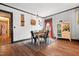 Cozy dining room features wood floors and a light color scheme at 906 Perry Rd, Zebulon, NC 27597