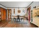 Farmhouse dining room with wood floors, neutral rug, and vintage-inspired decor at 906 Perry Rd, Zebulon, NC 27597