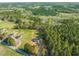 Aerial view of new home surrounded by dense woods and open land at 9550 Stallings Road Rd, Spring Hope, NC 27882