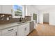 Kitchen with stainless steel appliances, dark hardware, granite countertops, and tile backsplash at 9550 Stallings Road Rd, Spring Hope, NC 27882