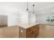 Open floor plan featuring a large kitchen island with drawers, granite counters, and wood flooring at 9550 Stallings Road Rd, Spring Hope, NC 27882