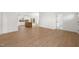 Open-concept living space featuring wood floors and lots of natural light flowing into the kitchen at 9550 Stallings Road Rd, Spring Hope, NC 27882