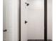 Modern shower featuring white subway tile, bronze hardware, and a glass door at 9550 Stallings Road Rd, Spring Hope, NC 27882