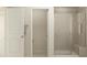 Bathroom featuring a glass enclosed shower with tile surround and bench seating at 1002 Sora Way, Durham, NC 27703