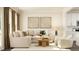 Cozy living room with a comfortable sectional sofa, stylish coffee table, and contemporary artwork at 1002 Sora Way, Durham, NC 27703