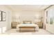 Inviting bedroom with recessed ceilings, bedside tables with lamps, and comfortable seating at 1011 Red Roses Ave, Durham, NC 27703
