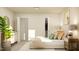 Serene bedroom featuring a king bed, stylish dresser, and a large potted plant at 1011 Red Roses Ave, Durham, NC 27703