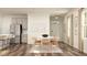 Open dining room with modern table, chairs, and stainless steel refrigerator at 1011 Red Roses Ave, Durham, NC 27703