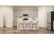 Stylish kitchen with stainless steel appliances, an island, and ample counter space at 1011 Red Roses Ave, Durham, NC 27703